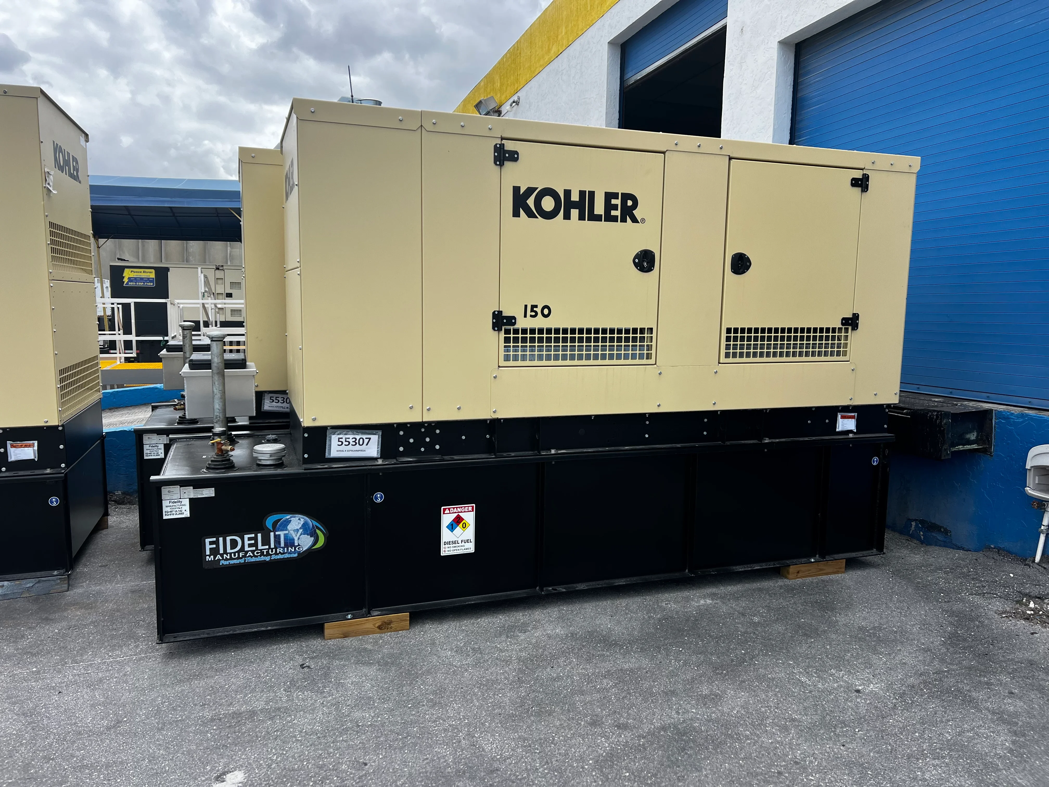 Kohler 150 kW diesel generator with cream enclosure on black steel skid frame
